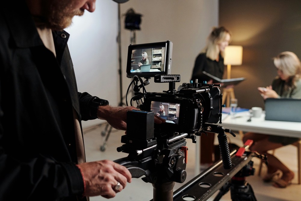 Creative team reviewing footage together on a large screen